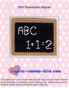 a crocheted blackboard magnet with the words abc and 1232 on it