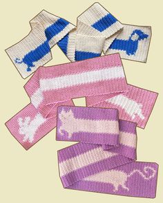 four knitted scarves are shown on a beige background, one is pink and the other is blue