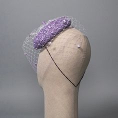 Mini beret fascinator in lavender guipure lace and sinamay straw, draped in ombré dyed veiling with matching chenille dots. One of a kind! Materials: Lace, Sinamay, Veiling, Grosgrain, Vintage Millinery Chenille, Wire Style: Fascinator Attachment: Hat elastic Measurements: 6.5" diameter (16.5 cm) Hat Box: 12 in How to Wear: Worn on left side of head Ready to Ship! 🌱 Sinamay straw, also known as abaca, is a sustainable textile and listed as a United Nations' Future Fiber.🌱Please read FAQ's & Shop Policies before purchasing. Each Milli Starr piece is meticulously shaped and sewn by hand in my studio in Austin, Texas. Beret Fascinator, Vintage Millinery, Sustainable Textiles, Hat Box, Guipure Lace, United Nations, Austin Texas, Shop Policies, Fascinator