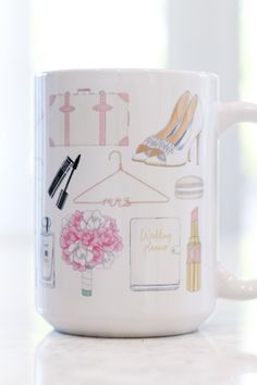 a white coffee mug with various items on it