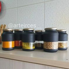 there are many different types of spices on the counter top in this kitchen, all lined up and ready to be put into jars