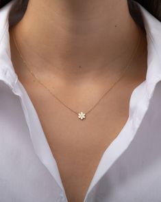 Beautifully handcrafted 14k solid gold dainty flower pendant with a single small diamond, hanging from a dainty cable link chain. A classic and timeless necklace, lays beautifully by itself or layered. Diamond Quality: VS Size: Approx. 7mm Weight: Approx. 1 gram Standard Production: 4-8 business days Rush Order Production: 2-5 business days Shipping: Select shipping method at checkout. Shipped from our L.A. Studio. Cute Small Necklaces, Flower Gold Pendant, Dainty Gold Pendant, Dainty Gold Necklace Pendant, Small Chains Gold With Pendant, Cute Gold Pendants, Cute Necklaces Aesthetic, Chains With Pendants, Minimal Jewelry Necklace