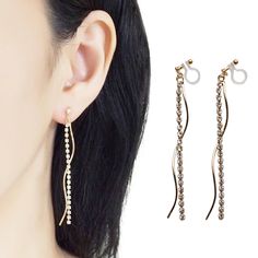 Gold Rhinestone Chain Clip On Earrings, Dangle Waved Bar Invisible Clip On Earrings, Non Pierced Earrings, Modern Long Threader Clip-ons 🌟MiyabiGrace shop home. More invisible clip on earrings: click here https://www.etsy.com/shop/MiyabiGrace ✨Feminine dangle long chain invisible clip on earrings are available. https://www.etsy.com/shop/MiyabiGrace/items?ref=l2-shopheader-name&search_query=dangle+chain+-titanium Details ◆Length:2.75 inches (7 cm) ◆Weight:2 g (0.07 oz) ◆Color: Gold tone ★Payment Modern Feminine Style, Non Pierced Earrings, Rhinestone Chain, Gold Clips, Loop Earrings, Crystal Chain, Birthday List, Business Planner, Gold Rhinestone