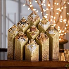 six wooden ornaments sitting on top of a table