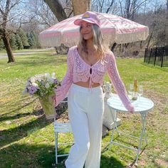 Introducing the newest addition to our bestselling collection - the Poolside Crochet Top NOW in a dreamy pale pink hue! This top features a cropped fit that's perfect for pairing with high-waisted bottoms, and a front adjustable tie that allows for a customizable fit. The full long sleeve crochet design adds a touch of bohemian elegance to any outfit. Long Sleeve Cover Up Crop Top, Feminine Cropped Top For Vacation, Feminine Cropped Top For Brunch, Chic Pink Cropped Top, Spring Loungewear Cropped Crop Top, Feminine Crop Top For Beach In Spring, Feminine Crop Top For Spring Beach Days, Feminine Spring Crop Top For Beach, Pink Cropped Top For Vacation