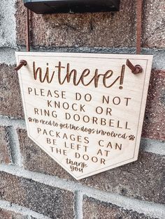 a sign that is on the side of a brick wall saying, please don't knock or ring door bell