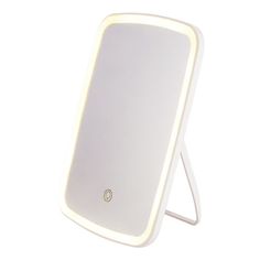 a white light up mirror on a stand