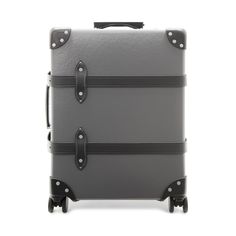 James Bond's adventures have taken him all over the globe — often on the same mission. Fellow British institution Globe-Trotter pays homage to 007's travels with this graphite grey carry-on. It's crafted from the brand's signature Vulcanized Fibreboard, which is both lightweight and rugged, and accessorized with black leather corners, handmade black leather handles, a co-branded metal plaque, and carbon steel locks. Inside is a rich navy drop-in lining with black webbing straps to keep contents Luxury Cases With Luggage Sleeve For Trips, Luxury Travel Cases With Luggage Sleeve, Luxury Rectangular Cases For Trip, Luxury Rectangular Travel Cases, Rectangular Coated Canvas Luggage For Business Trips, Classic Travel Cases With Leather Trim, Luxury Portable Cases, Luxury Travel Cases, Classic Coated Canvas Luggage With Sleeve