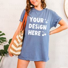 Denim Blue Relaxed Fit Crew Neck Top, Denim Blue Crew Neck Top With Relaxed Fit, Denim Blue Cotton Crew Neck Top, Casual Denim Blue Short Sleeve T-shirt, Blue Short Sleeve Shirt With Branding, Blue Cotton Tops With Branding, Blue Casual T-shirt With Custom Print, Casual Blue T-shirt With Custom Print, Blue Relaxed Fit Branded Tops