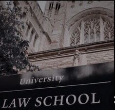 the law school sign is in front of an old building