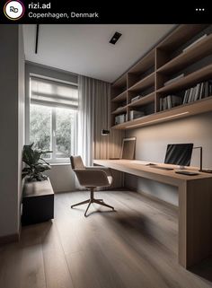 a room with a desk, chair and bookshelf next to a large window