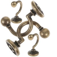 several antique brass knobs and handles on a white background