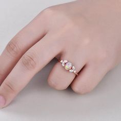 This is 5x7mm oval cut pink opal engagement ring rose gold. The accent stones are VVS man made cz diamond. The stones can be replace with other gemstones.For example,if you don't like the CZ accent,you can ask me replace it with tourmaline,aquamarine,diamond,emerald,sapphire... For custom making jewelry,it can be made in 2 different metal(Please contact me if you need this one made in solid gold). 1,Solid gold,including 14/18k white/rose/yellow gold. 2,925 sterling silver with white/yellow/rose Opal Engagement Ring Rose Gold, Art Deco Women, Opal Engagement Ring, Opal Engagement, Engagement Rings Opal, Hand Ring, Rose Engagement Ring, Art Deco Ring, Cz Diamond