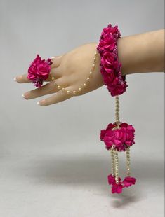 Indian bridal handmade Pink flower floral jewelry set. It is also known as Gotta Jewelry  Often Used in Haldi,  Mehandi, Dholki, Mayyo and Wedding Functions Set Includes: 1 Hand Bracelets With Rings *CARE: Avoid contact with sweat, hair sprays, perfumes, water, abrasive soaps or chemicals. Avoid using velvet boxes for Jewelry. Can be stored in Zip Lock bag and a Box. Please Note: Slight variation in color and texture may occur in picture due to photographic reasons. Pink Wedding Bracelets For Diwali, Holud Jewellery Flower Jewelry, Haldi Jewellery Bridal Flowers Yellow And Pink, Pink Floral Jewellery For Haldi, Mogra Flower Jewellery For Haldi, Flower Mala, Flower Gajra, Hand Bracelet With Ring, Flower Bracelet Wedding