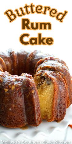 a bundt cake on a white plate with the words, buttered rum cake