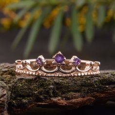 "Crown ring, Gold wedding ring, Amethyst ring, Rose gold ring, Purple stone ring, February birthstone, Women wedding ring, Gold crown ring WE OFFER UNLIMITED PERIOD INSTALLMENTS PLAN This is a beautiful, stunning, feminine ring that works well for all occasions, styles, and ages. You will love it! Ring information: Stone: Amethyst Approximate size: central stone - 2mm, 2 accent stones 1.5mm Metal type: Gold Metal stamp: 14k Gold Customization / Replacements It's easy to create jewelry that's per Rose Gold Amethyst Birthstone Ring For Promise, Rose Gold Amethyst Birthstone Promise Ring, Rose Gold Crown Design Ring As Gift, Rose Gold Amethyst Promise Ring, Rose Gold Amethyst Ring With Accent Stones For Anniversary, Rose Gold Amethyst Ring For Promise, Rose Gold Amethyst Rings With Halo Setting, Rose Gold Crown Design Promise Ring, Rose Gold Ring With Crown Design