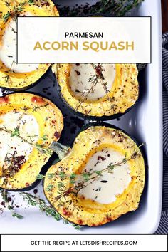 baked acorn squash with parmesan cheese and herbs in a baking dish on a white platter