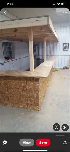 an image of a bar made out of plywood planks in a building being built