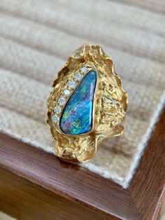 Item Information Weight (ring)           11.7g Weight (opal)           2.85cts Weight (diamonds )      0.16cts The size of the ring can be risized Attention：This is a collectible level Opal jewelry, It's second-hand jewelry auctioned from Japan There are no quality issues or cracks, Accompanied by the certificate* More Affordable price，Only make a reasonable profit，So I can offer a high quality item and affordable price for every customers， Better service ，if you have any problem with my item，pl Boulder Opal Ring, Opal Wedding, Jewelry Auction, Jewelry Birthday, Hand Jewelry, Opal Ring, Boulder Opal, Opal Jewelry, Opal Rings