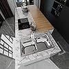 an aerial view of a kitchen and dining room with stainless steel appliances, counter tops, and flooring