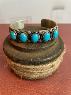 Stunning Navajo Artist Signed Ronald Tom Sterling Silver & Turquoise Multi Stone Stamped Cuff Bracelet Layaway Available 7" around including gap.   Please see pictures for more measurements.  This cuff is absolutely killer!  61.3 grams Before purchasing, please make sure your shipping address is correct in your Etsy account. I will not change the shipping address after purchase due to so much buyer fraud going around. If you purchase and need an address change, we will have to cancel the transac Adjustable Traditional Turquoise Ring, Handmade Southwestern Cuff Bracelet, Address Change, Multi Stone, Silver Turquoise, Turquoise Sterling Silver, Etsy Account, Cuff Bracelet, Cuff Bracelets