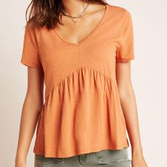 Anthropologie Holden T.La Tee T.La Size Medium Gold Short Sleeves Deep V Neckline Flounced Hem Cotton Blend New With Tags My Mannequin Has 34in Bust, 27in Waist, And 35.5in Hip Measurements. Orange V-neck Top For Day Out, Orange Summer T-shirt For Everyday, Chic Orange Short Sleeve Top, Chic Peach Summer Tops, Everyday Orange Crew Neck Top, Orange Crew Neck Top For Everyday, Orange Relaxed Fit Top For Everyday, Chic Orange Cotton Blouse, Trendy Orange Cotton Blouse