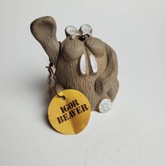 an elephant statue with a tag on it's ear