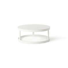 a white coffee table sitting on top of a white floor