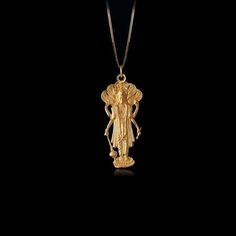 Elevate your faith with our 14k Gold Vishnu Pendant. This solid gold necklace showcases intricate craftsmanship, symbolizing divine protection and devotion in Hinduism. Explore our collection of Vishnu-themed jewelry, perfect for those seeking a unique and meaningful piece inspired by Lord Vishnu and Hindu spirituality. PENDANT INFORMATIONThis pendant is made of real, solid gold.• Made in USA• Material: 14k or 18k solid gold• Finish: polished• Height: 1.5" (37,5 mm) x Width: 0.65" (16,5 mm)• Pen Hindu Spirituality, Divine Protection, Solid Gold Necklace, Lord Vishnu, Themed Jewelry, Gold Design, Gold Finish, Handcrafted Jewelry, Custom Jewelry