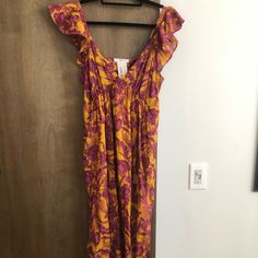 The Dress Has Lining To The Thigh - Colors Are So Pretty & It Is Lightweight. I’ve Included Pictures Of What The Dress Looks Like On! I’m Around 5”11 And Prefer My Dresses To Be A Bit Longer, It Was Too Short For My Liking. Purple Sundress Midi Dress For Vacation, Purple Floral Print Midi Dress For Vacation, Purple Floral Midi Dress For Vacation, Vacation Purple Floral Print Midi Dress, Summer Flowy Purple Midi Dress, Purple Flowy Sundress Midi Dress, Purple Sleeveless Midi Dress With Ruffles, Flowy Purple Sundress Midi Dress, Sleeveless Purple Midi Dress With Ruffles