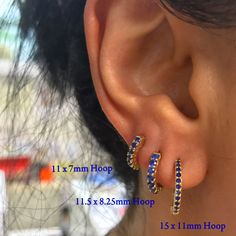 This huggie hoop earring is composed of 14K solid gold and AAA quality round brilliant cut natural real Blue Sapphires. This classic earring features a secure hinged closure for the ease of taking them on and off. Huggie Dimensions: outer diameter approximately 11.5mm inner diameter approximately 8.25mm hoop width 1.90mm post thickness 0.75mm post length 6.5mm Total Carat Weight: approximately 0.42 carats (for the pair) Backing Type: Latch Back Metal Finish: High Shine Polish This design is avai Classic Earrings, Affordable Gifts, Black Rhodium, Huggie Hoop Earrings, Single Earring, Natural Sapphire, Sapphire Gemstone, Jewelry Earrings Hoops, Jewelry Gift Box