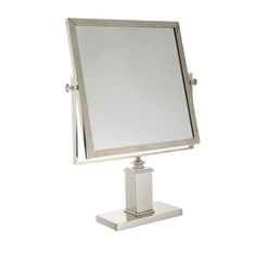 a silver square mirror on a stand