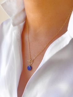 "A vibrant, circular lapis lazuli stone hung from the toggle clasp of a 14k gold filled cable chain. A piece with serious impact! The necklace measures 18\" in the chain with another 1\" for the pendant drop, though custom lengths are available on request. It is available in gold filled, rose gold filled and sterling silver. All pieces come beautifully gift wrapped. Lapis Lazuli is one of the most sought after stones in use since man's history began. Its deep, celestial blue remains the symbol of royalty and honour, gods and power, spirit and vision. It is a universal symbol of wisdom and truth. Gold filled is made by heat and pressure bonding a layer of karat gold to a metal core. Unlike gold plated, gold filled has an actual layer of karat gold, not just a microscopic film and with the p Luxury Single Strand Lapis Lazuli Necklace, Celestial Blue, Lapis Lazuli Jewelry, Foot Socks, Lapis Lazuli Pendant, Lapis Lazuli Necklace, Lapis Lazuli Stone, Fantasy Jewelry, Retail Therapy