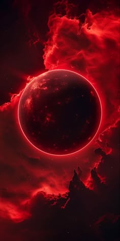 an eclipse in the sky with red clouds