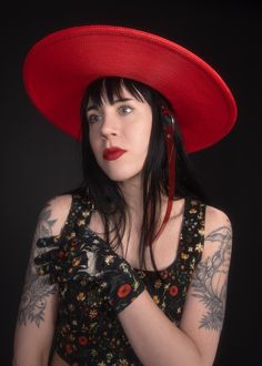 This red full-size faux straw hat is trimmed with a translucent red PVC buckle hat band and harness straps that buckle under the chin. Nice and structured, not floppy, with a wide brim and a round crown. The ultra-oversized brim paired with the bright red color makes this a dramatic statement piece! Fits up to a 23" head size. Shipped with a hat box. Material: 100% Polypropylene Crown Width: 6.5 inch Crown Height: 3.25 inch Brim Width: 5 inch This item is OVERSIZED so unfortunately shipping will Lydia From Beetlejuice, Red Harness, Lydia Beetlejuice, Crown Heights, Hat Box, Hat Band, Beetlejuice, Make Time, Wide Brimmed