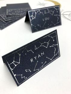 three black and white business cards with stars on them, one has the word ryan printed on it