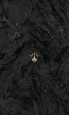 a black and gold wall with a white crown on it's head in the middle