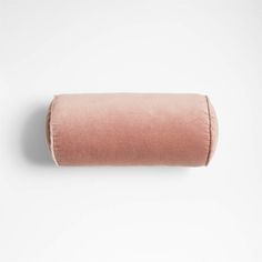 a roll of pink colored fabric on a white background, with the end rolled up