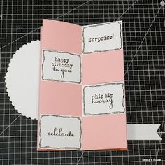 a pink and white card with words on it that say surprise, happy birthday to you