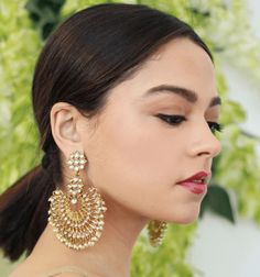 Designed in the USA, handcrafted with love by our artisans in India these beautiful Blossom Box Earrings come in a gold plated finish with stunning stones to make these exquisite earrings really special - this pair are light in weight & can be paired with almost any outfit. Perfect accessory for every jewelry box! Handcrafted Metal: Metal Alloy, Gold Plated Stone: Faux mini pearls Size: Length: 3" Width: 2.5" Elegant Plug Earrings For Festive Celebration, Elegant Festive Celebration Plug Earrings, Gold Fusion Hoop Earrings For Festive Season, Festive Fusion Style Gold Hoop Earrings, Festive Fusion Gold Hoop Earrings, Gold Fusion Hoop Earrings For Festive Occasions, Pierced Drop Bridal Earrings For Festive Occasions, Festive Gold Plated Bridal Earrings, Elegant Chandbalis With Tilla For Reception