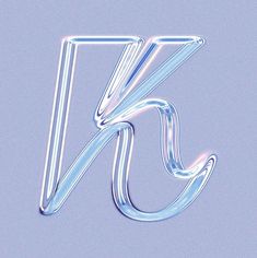 the letter k is made up of glass and has an unusual shape that looks like it's floating in the air