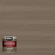 a can of behrold waterproofing stain and sealer on a wooden floor