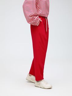 Details: Knitted trousers in a rich red hue Loose tapered trouser shape Simple waistband, mid-rise design Side pockets Materials & Care: Polyester 61.4 % Cotton 36.6 % Spandex 2.0% Hand wash | Dry clean Do not bleach Size & Fit: Model is 5'7", Bust 32, Waist 24, Hips 35, wearing a size S Item #: LN1PA03 Red Elastane Trousers, Red Elastane Pants For Work, Red Ankle-length Loungewear Bottoms, Red Ankle-length Pants For Loungewear, Red Ankle-length Pants With Elastic Waistband, Red Ankle-length Bottoms With Elastic Waistband, Red High-waisted Elastane Pants, Red High-waisted Elastane Bottoms, Chic Red Pants With Elastic Waistband