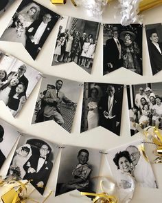 black and white photo collages hanging on a string with gold streamers next to it