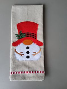 a white towel with a snowman on it