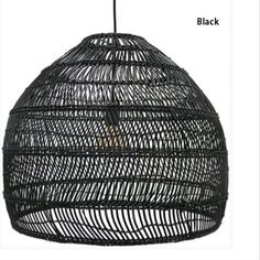 a black rattan hanging light fixture on a white background