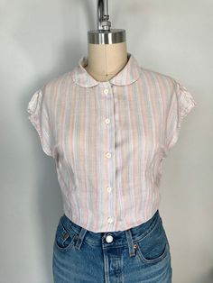 "Vintage Organic Cotton striped shirt.   Peter Pan collar fitted shirt Short sleeves with slits on shoulders Measure: Shoulder to shoulder-16.5\" Armpit to armpit-17.5\" Waist-28\" Total length-24\" size: XS Comes from smoke/pet free home" Casual Collared Blouse With Vertical Stripes, Classic Top With Striped Collar For Daywear, Summer Vertical Stripes Button-up Blouse, Summer Top With Striped Collar, Fitted Striped Button-up Shirt, Summer Daywear Top With Striped Collar, Fitted Button-up Shirt With Vertical Stripes, Fitted Vertical Stripe Button-up Shirt, Summer Collared Tops With Vertical Stripes