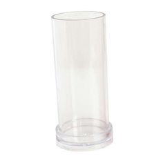 a clear glass vase sitting on top of a white table