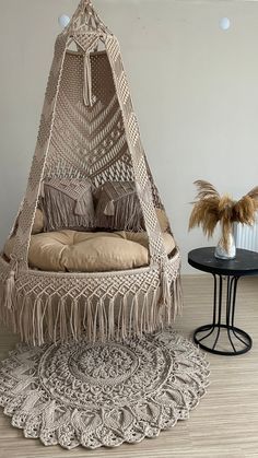 a chair that is sitting in the middle of a room with a rug on it