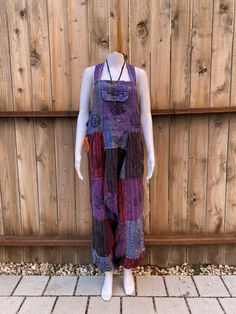 100%  Nepali cotton overalls!  The perfect pair of comfy, each to wear hippie overalls. Unisex  Has front, side, and back pockets.  Simple design, loose fit and lightweight.  Harem pant style. (Drop crotch / MC Hammer)  Arm lengths have 3 adjustable button sizes to shorten or length top.  Great summer staple piece for casual and boho feel. Colors are beautiful and vibrant  Easy to wear  Nice thickness to the overall and not see through Multiple Sizes  S/M and M/L  100% Cotton  Made in Nepal 🇳🇵 Bohemian Cotton Jumpsuits And Rompers With Relaxed Fit, Cotton Overalls For Festivals, Cotton Overall Jumpsuit For Festival, Cotton Overall Jumpsuits And Rompers For Festival, Cotton Festival Overalls And Rompers, Bohemian Cotton Jumpsuits And Rompers With Patchwork, Multicolor Cotton Jumpsuits And Rompers For Festivals, Bohemian Sleeveless Overalls With Pockets, Cotton Hippie Style Overalls